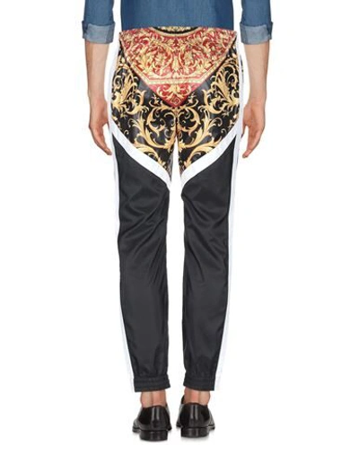 Shop Versace Pants In Black