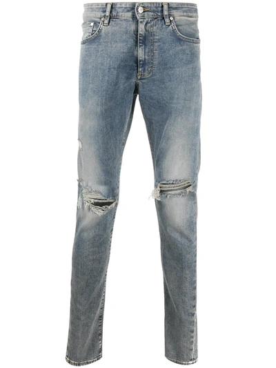 Shop Represent Distressed Skinny Jeans In Blue