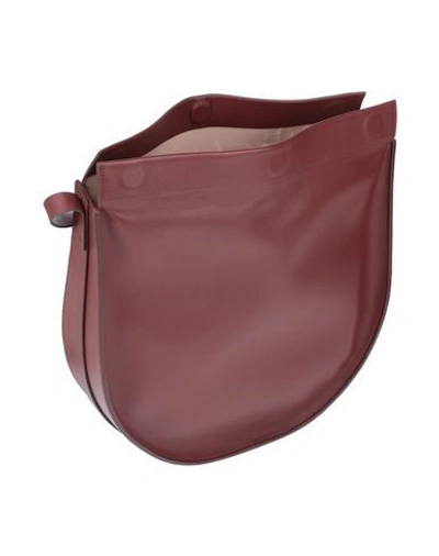 Shop Aesther Ekme Handbags In Brick Red