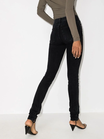 Shop Khaite Ankle-zip Mid-rise Skinny Jeans In Black