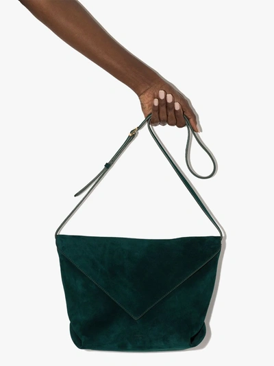Shop Khaite Envelope Suede Crossbody Bag In Green
