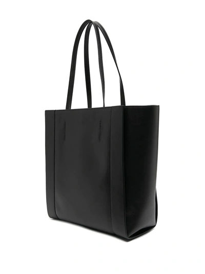 Shop Alexander Mcqueen Logo Embossed Tote Bag In Black