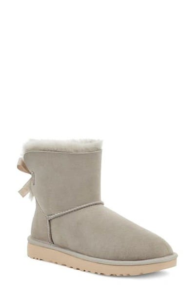 Shop Ugg Mini Bailey Bow Ii Genuine Shearling Bootie In Goat Suede