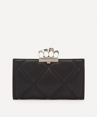 Shop Alexander Mcqueen Skull Four-ring Quilted Leather Flat Clutch Bag In Black