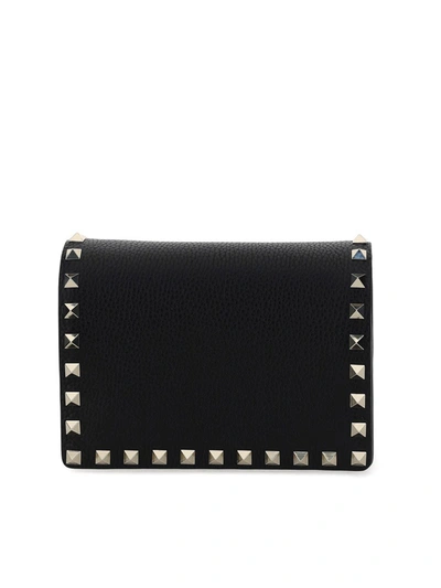 Shop Valentino Rockstud Pouch In Black