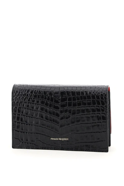 Shop Alexander Mcqueen Skull Embossed Shoulder Bag In Black