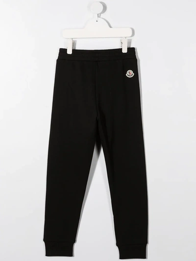 Shop Moncler Striped Cotton Sweat Pants In Black