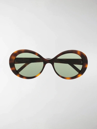 Shop Saint Laurent Round Frame Sunglasses In Brown