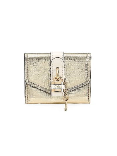 Shop Chloé Women's Mini Aby Metallic Leather Wallet In Gold