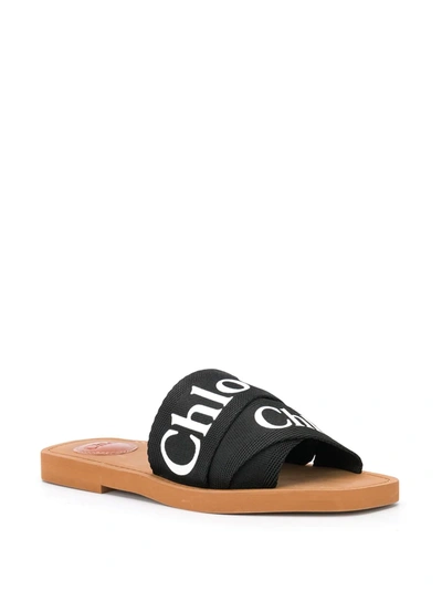 Shop Chloé Woody Logo Slides In Black