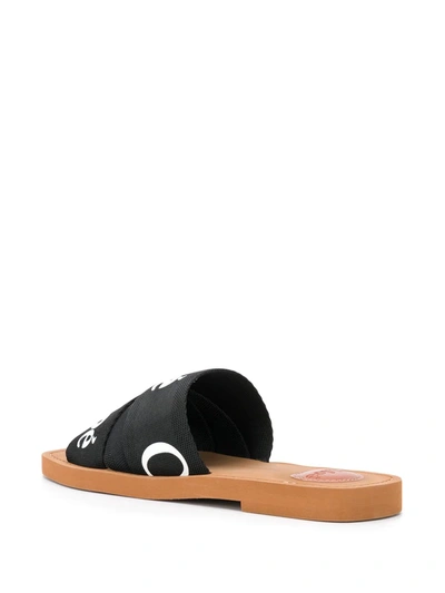 Shop Chloé Woody Logo Slides In Black