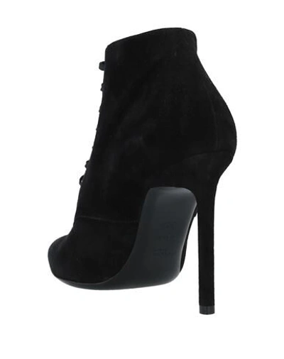 Shop Saint Laurent Ankle Boots In Black