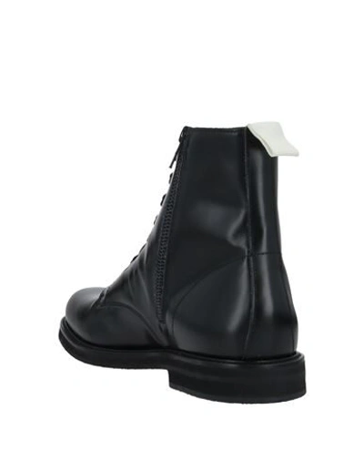 Shop Common Projects Boots In Black