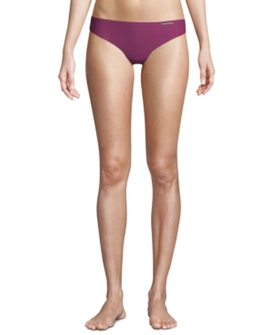 Shop Calvin Klein Women's Invisibles Thong Underwear D3428 In Loyal