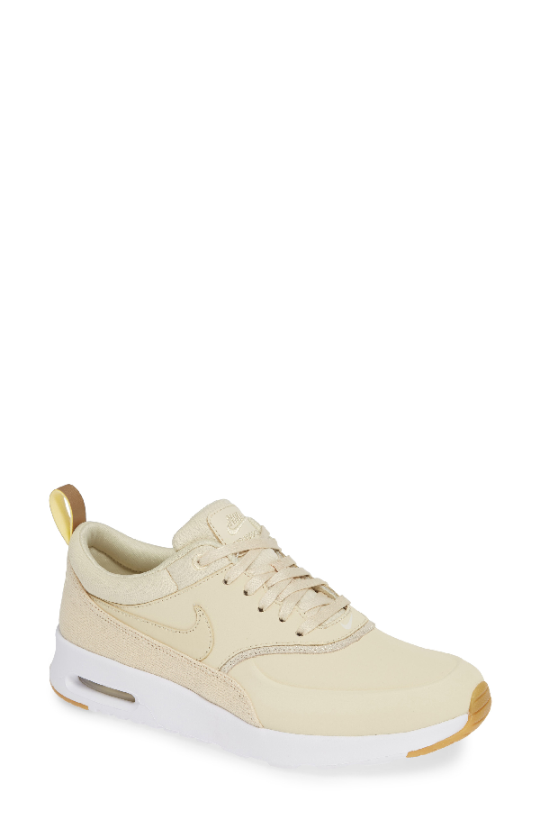 nike thea beige gold
