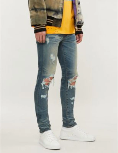 Amiri Ripped Regular-fit Straight Jeans In Classic Indigo