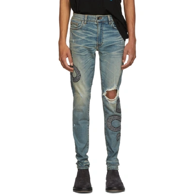 Amiri Skinny-fit Appliquéd Distressed Stretch-denim Jeans - Light Denim In Indwh