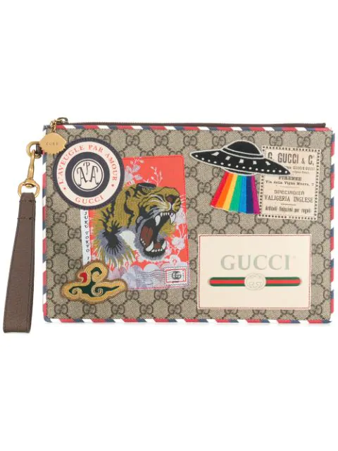 Gucci Courier Coated Gg Supreme Pouch In Brown | ModeSens