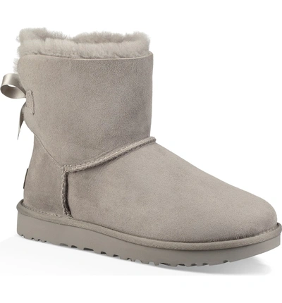 Ugg Mini Bailey Bow Ii Genuine Shearling Bootie In Seal Suede