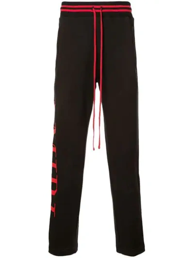Amiri Side Stripe Track Pants In Black