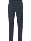 Prada Stretch Technical Fabric Trousers In Blue