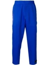 Prada Logo Patch Cropped Trousers In Blue