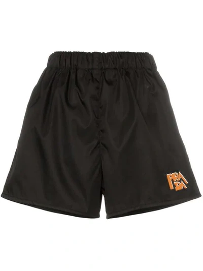 Prada Logo Patch Nylon Shorts In Black