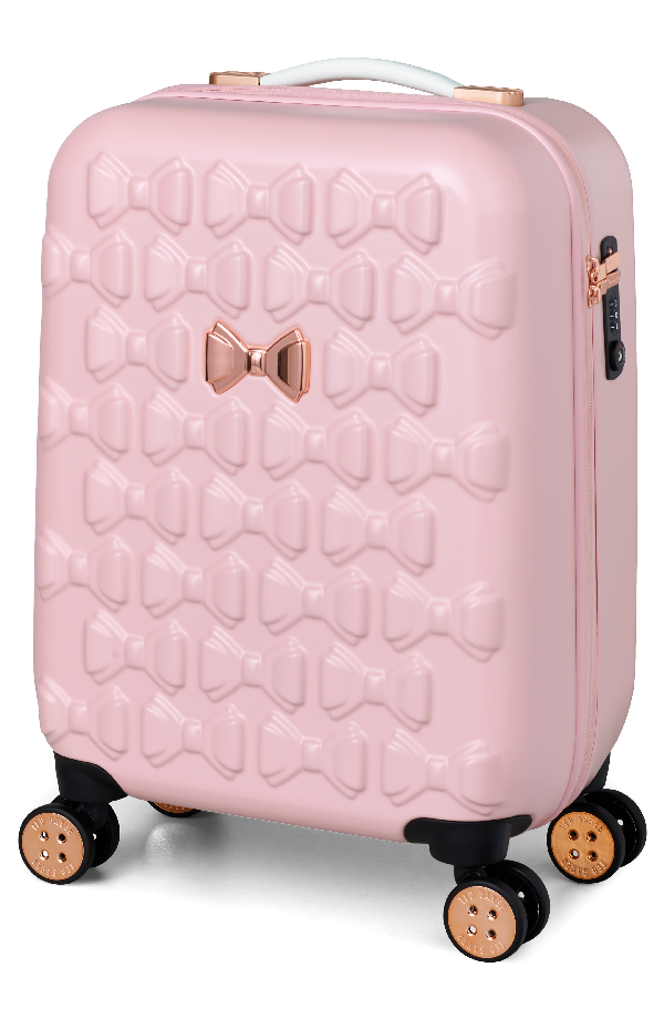 small pink luggage