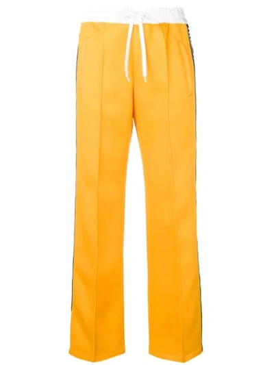 Miu Miu Logo Tape Track Trousers In Yellow