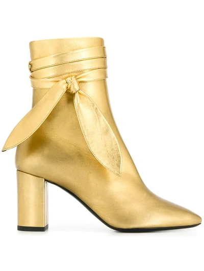 Saint Laurent Ankle Wrap Boots In Gold