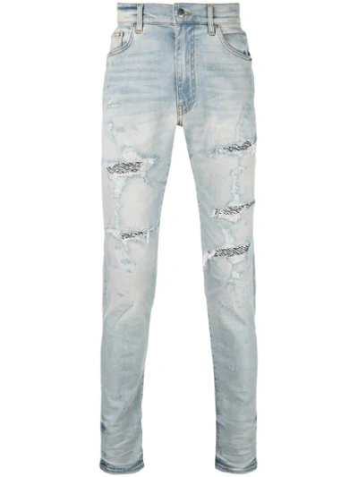 Amiri Distressed Detail Jeans In Blue