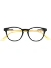 Gucci Oval Frame Glasses In Yellow