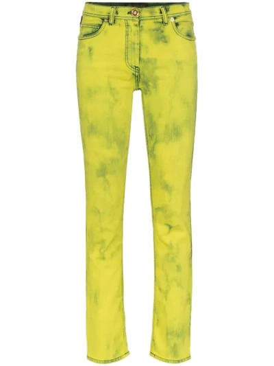Versace Acid Wash Logo Label Skinny Jeans In Yellow