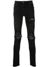 Amiri Ripped Skinny Jeans In Black