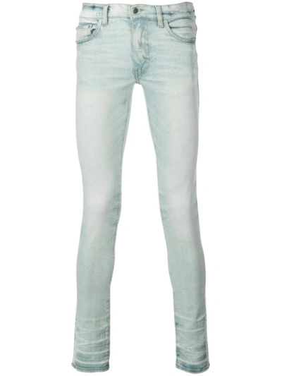 Amiri Stack Skinny Jeans In Blue