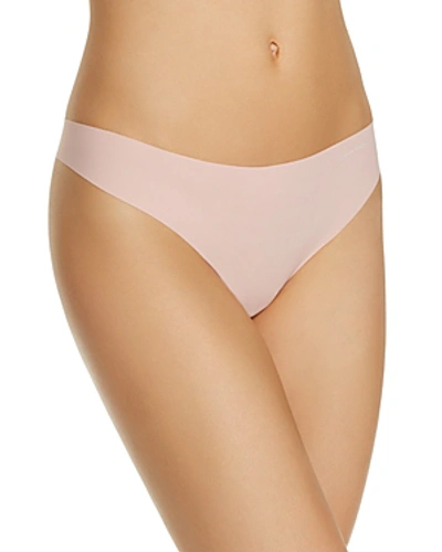 Calvin Klein Invisibles Thong In Peach Glow