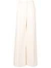 The Row Isla Pintucked Flared Trousers In Neutrals