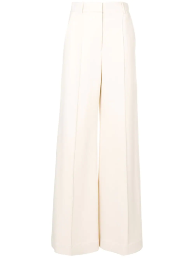 The Row Isla Pintucked Flared Trousers In Neutrals