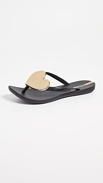 black and gold flip flops