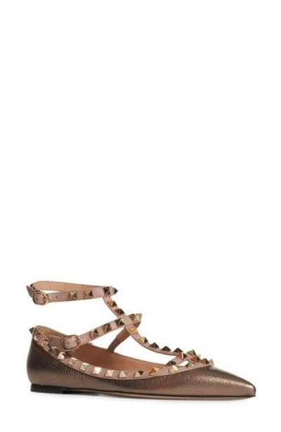 Valentino Garavani 'rockstud' T-strap Flat In Metallic Rust