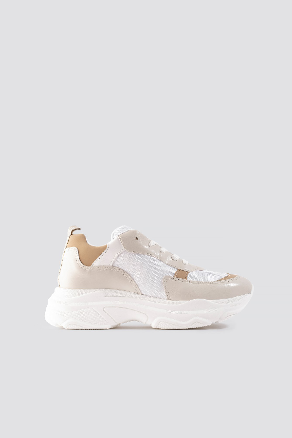 white beige trainers