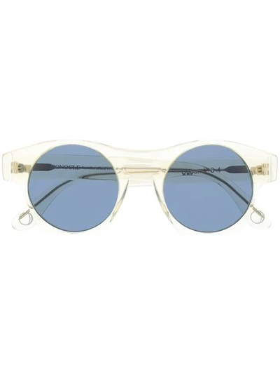 Monocle Eyewear Transparent Frame Round Sunglasses In White