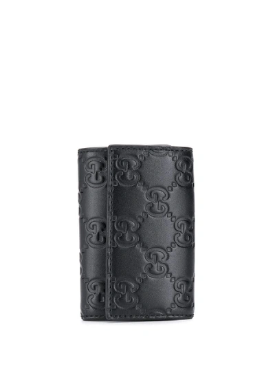 Gucci Signature Embossed Key Holder In Black