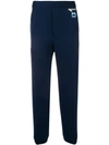 Prada Logo Patch Tapered Trousers In Blue