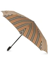Burberry Icon Stripe Folding Umbrella In 108 - Multicoloured