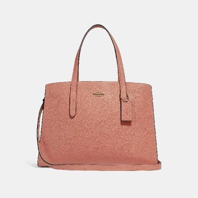 Coach Charlie Carryall In Pink