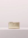 Kate Spade Sylvia Small Slim Bifold Wallet In Pale Gold