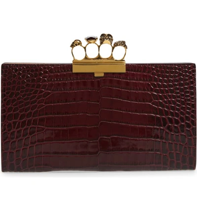 Alexander Mcqueen Four-ring Stamped Crocodile Clutch Bag In Velvet Red