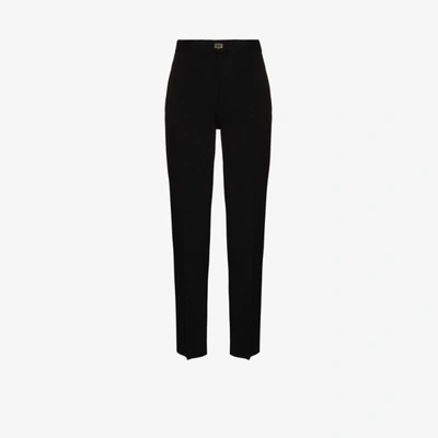 Ferragamo Virgin Wool Carrot Fit Trousers In Black