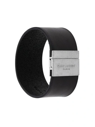 Saint Laurent Embossed Logo Cuff Bracelet In Black